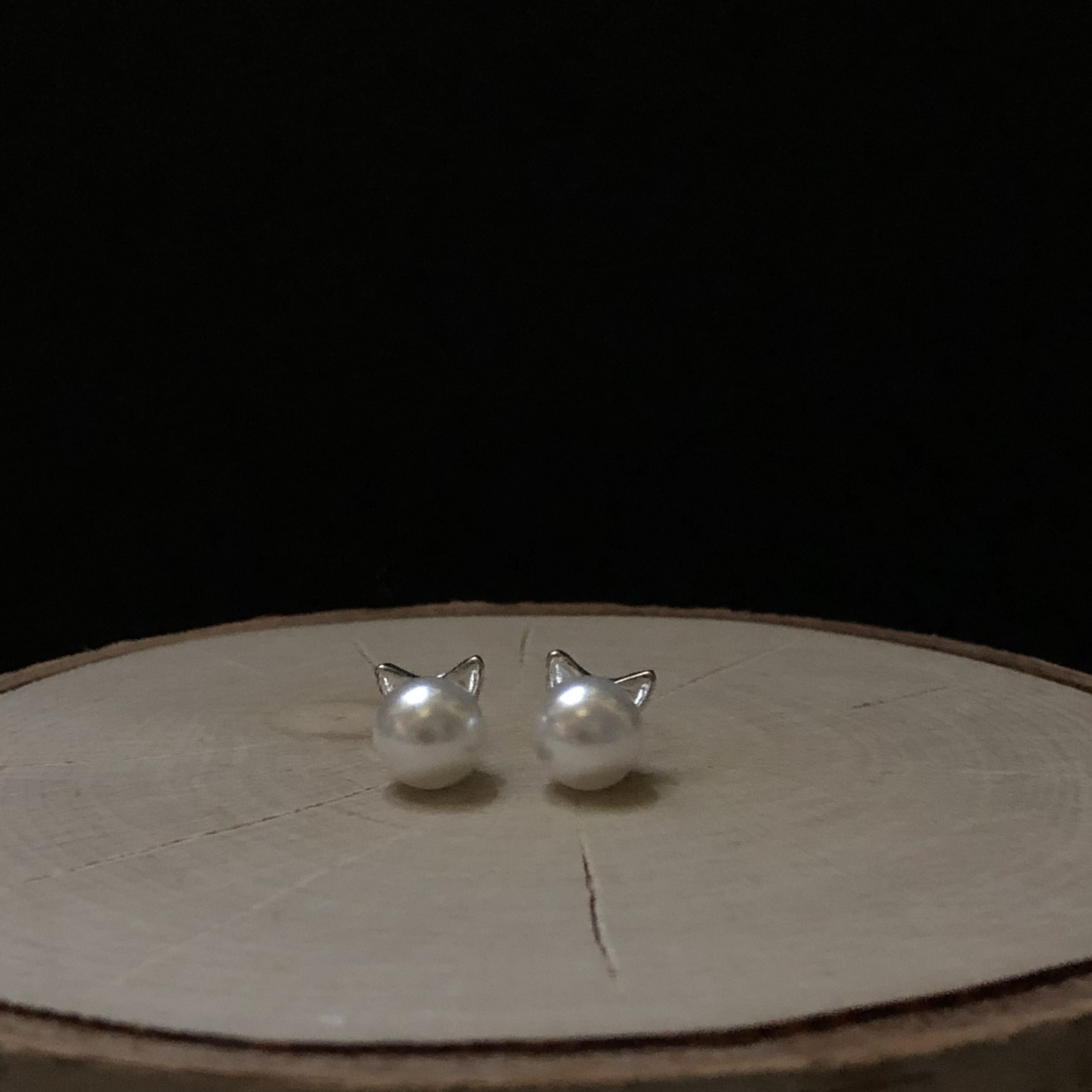 pearl cat post earrings closeup